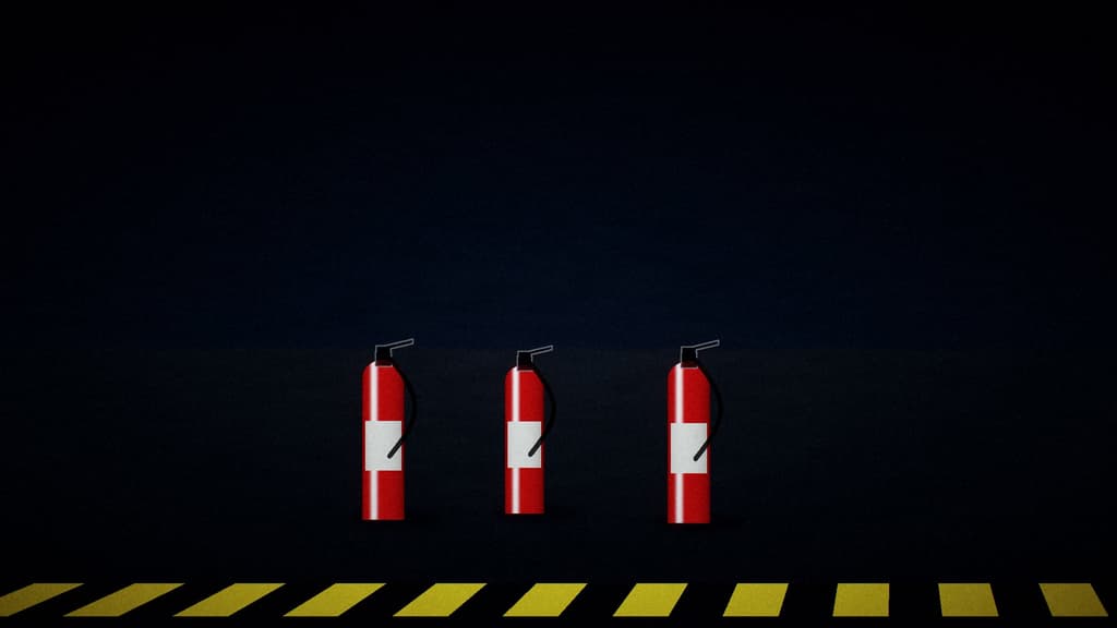 Extinguishers on standby behind a marked line